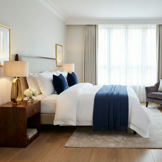 Serene bedroom with crisp linens and navy accents